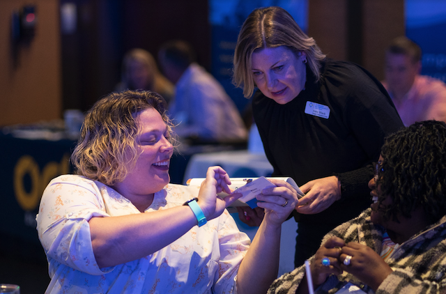 Amy helping at a conference